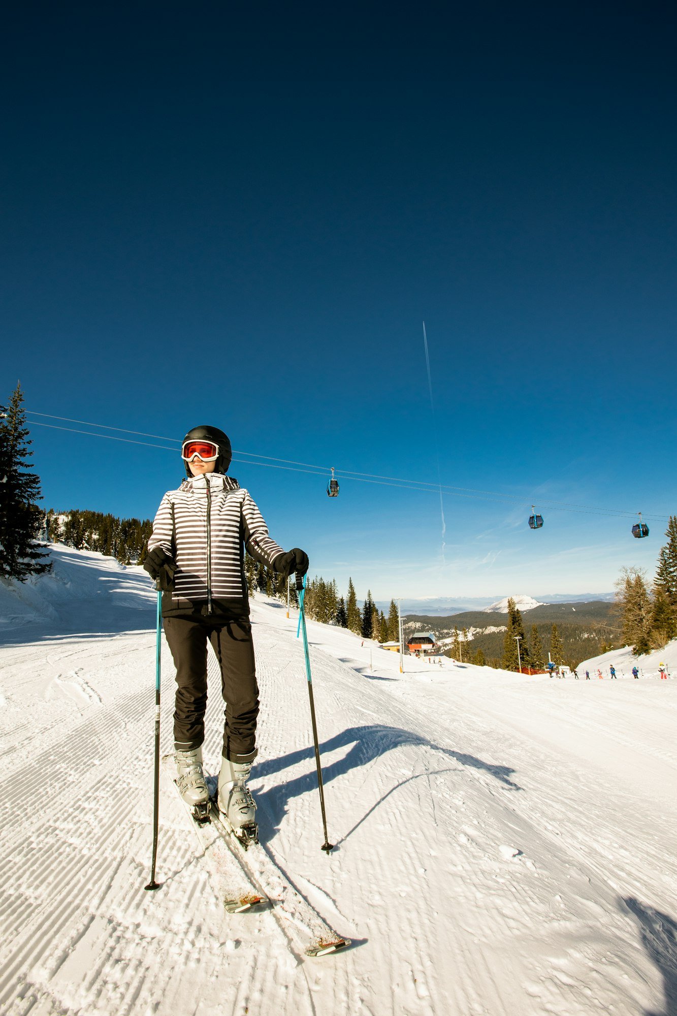 Young woman at winter skiing bliss, a sunny day adventure